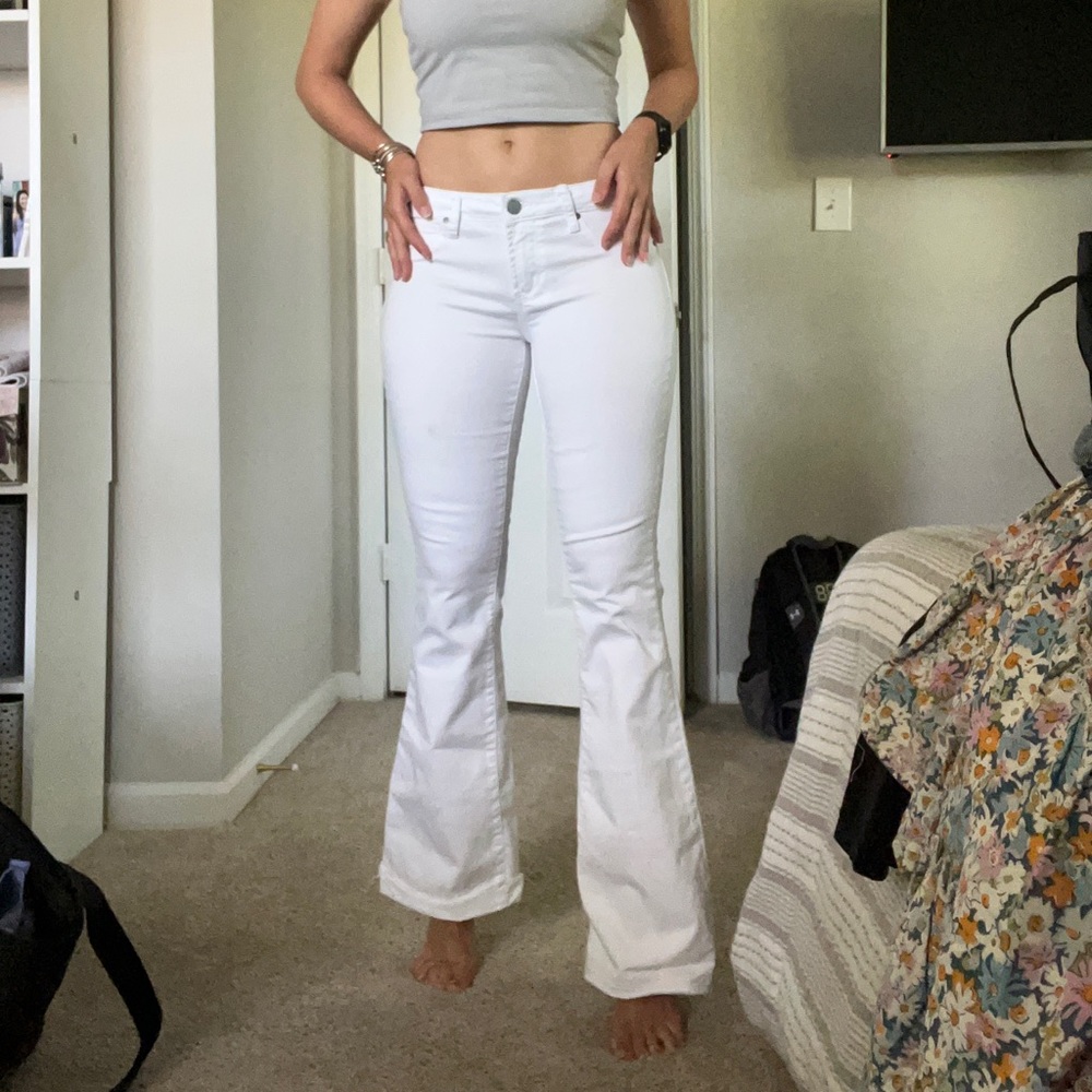 Long low rise white flare jeans